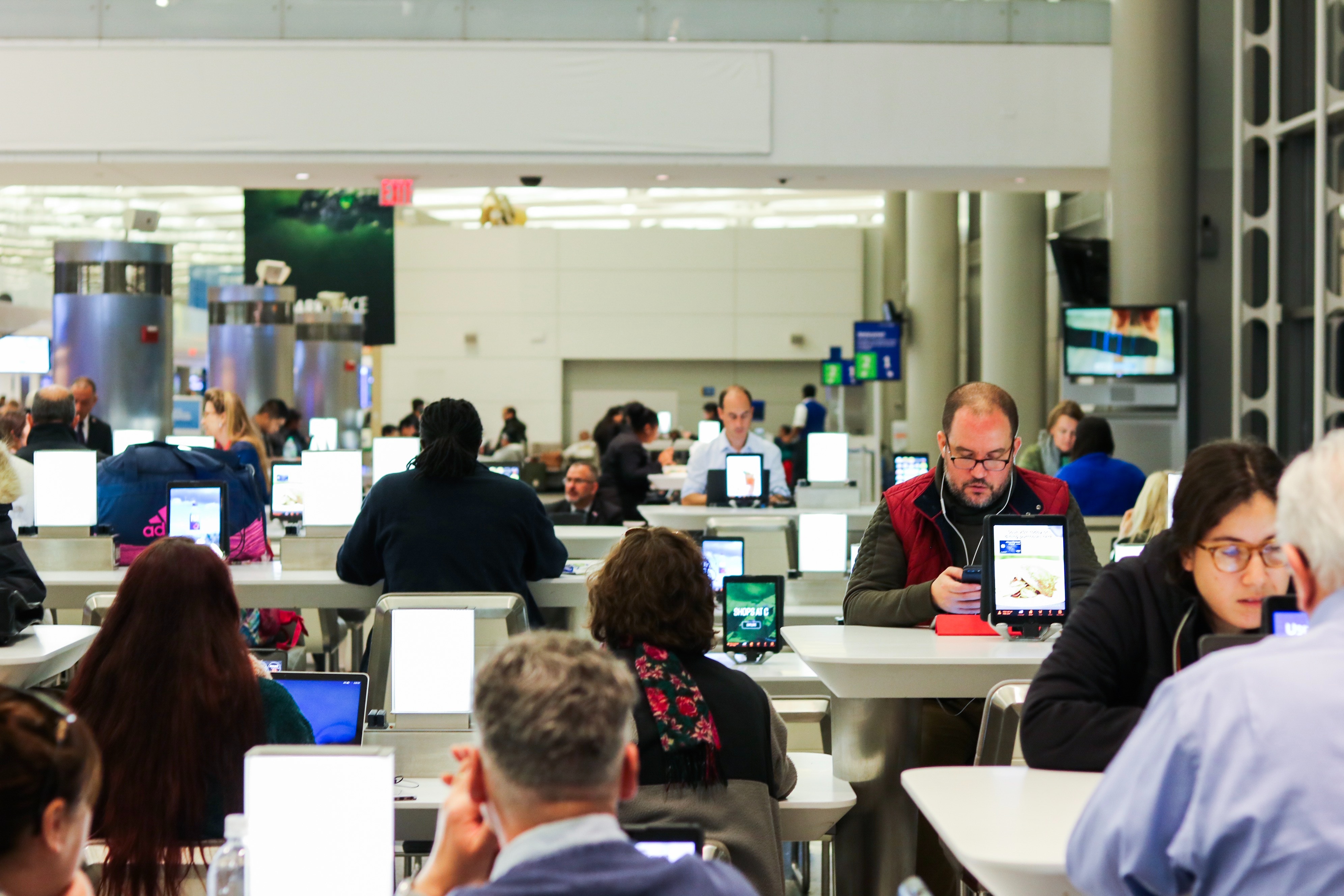 People in an airport lobby.